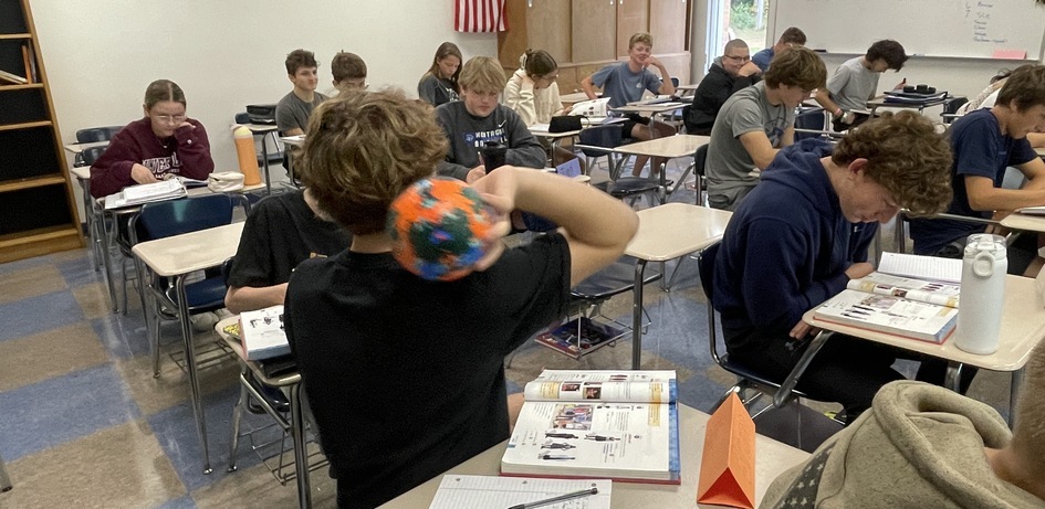 Student Tossing Ball
